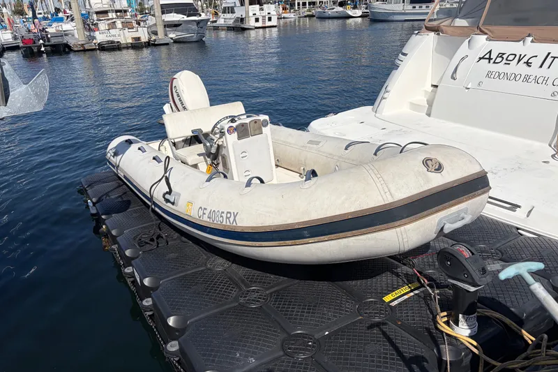 Slide: The Image of Inflatable boat docked beside 1999 Cruisers Yachts 3870 Esprit in marina. - 29