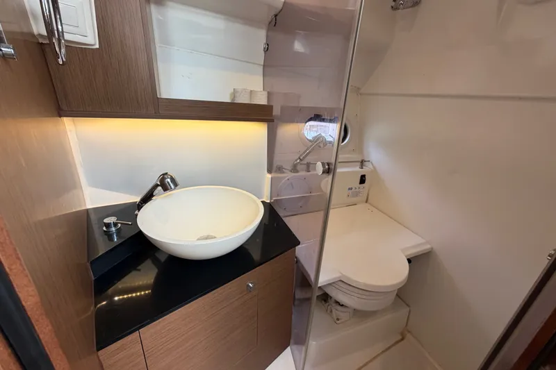 Slide: The Image of 2021 Jeanneau Cap Camarat 9.0 WA boat bathroom with modern sink and toilet. - 13