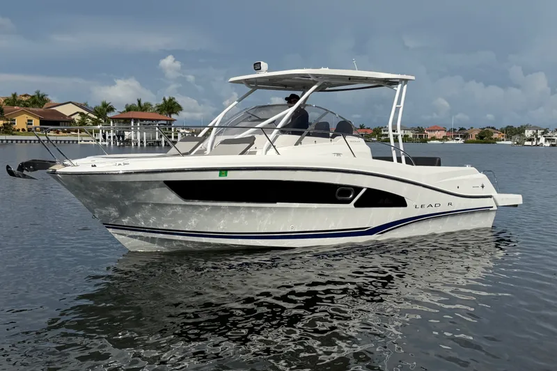Slide: The Image of 2021 Jeanneau Cap Camarat 9.0 WA boat on calm water, with modern design and sleek lines. - 7