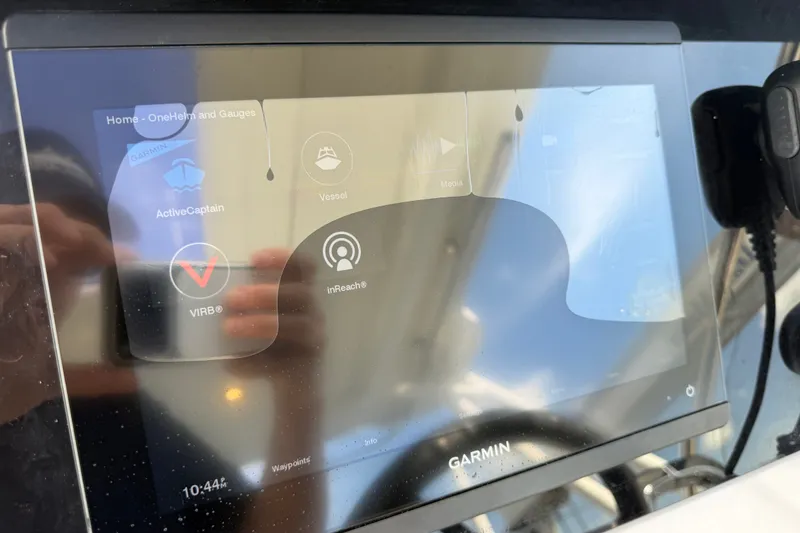 Slide: The Image of Garmin marine display on 2021 Jeanneau Cap Camarat 9.0 WA boat, showing navigation apps. - 18