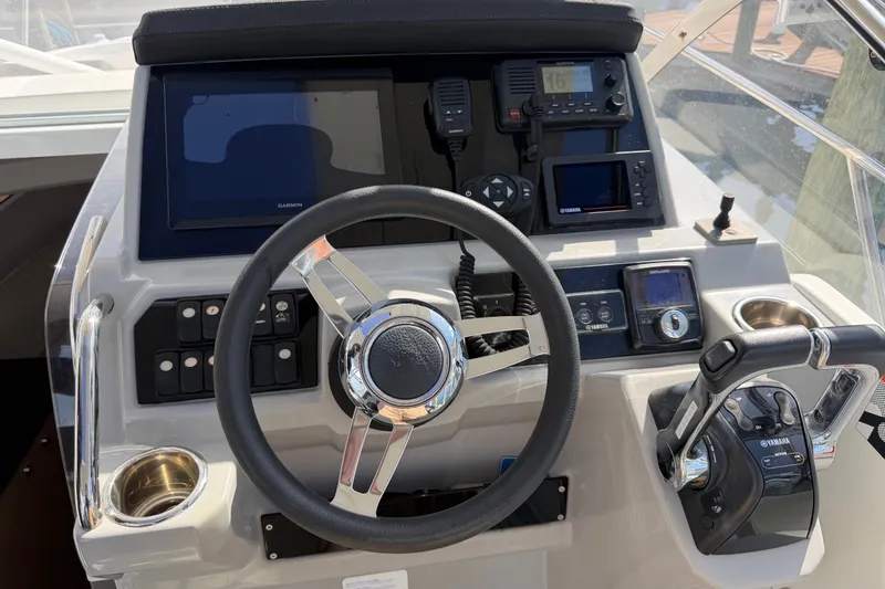 Slide: The Image of 2021 Jeanneau Cap Camarat 9.0 WA helm with Garmin navigation and Yamaha controls. - 16