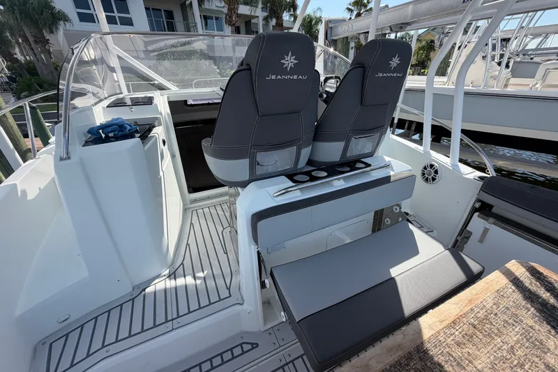 Slide: The Image of 2021 Jeanneau Cap Camarat 9.0 WA boat interior with dual seats and modern design. - 19