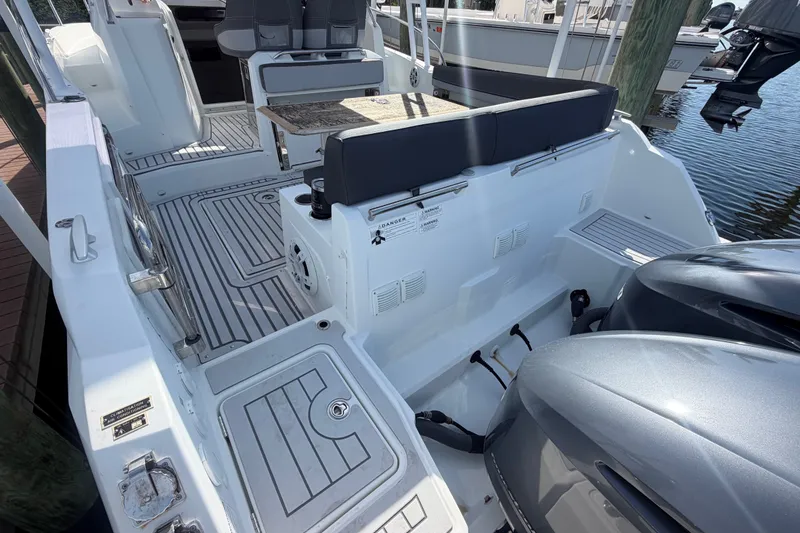Slide: The Image of 2021 Jeanneau Cap Camarat 9.0 WA boat interior with seating and twin engines. - 26
