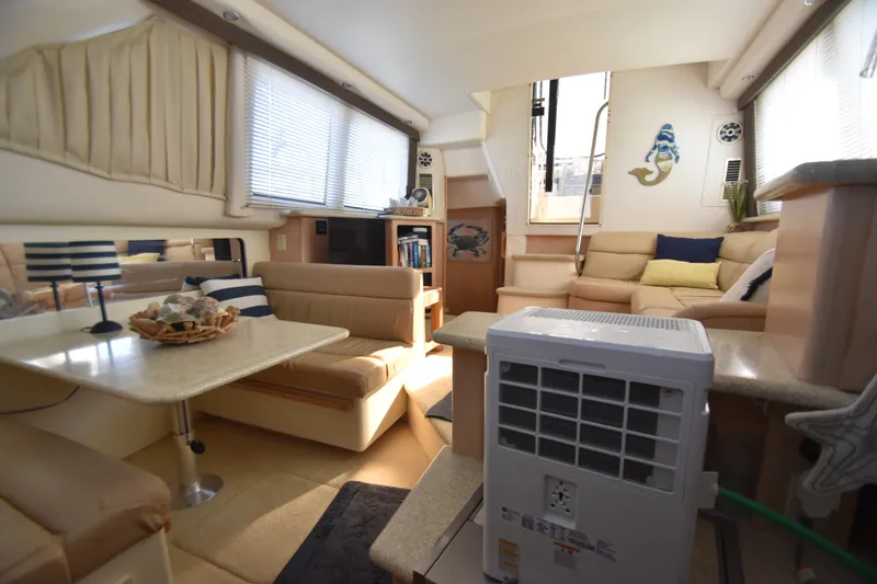 Slide: The Image of Interior of the 2000 Carver 356 Aft Cabin Motor Yacht with cozy seating area. - 9