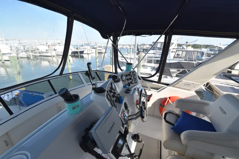 Slide: The Image of The cockpit of a 2000 Carver 356 Aft Cabin Motor Yacht overlooking the marina. - 4