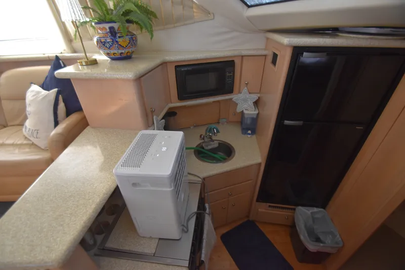 Slide: The Image of Interior of the 2000 Carver 356 Aft Cabin Motor Yacht with kitchen and seating area. - 8