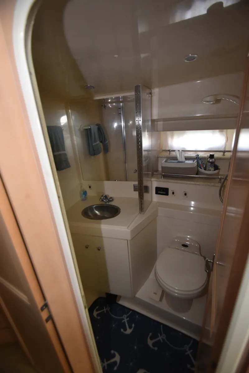 Slide: The Image of Bathroom in a 2000 Carver 356 Aft Cabin Motor Yacht with sink, toilet, and shower. - 10