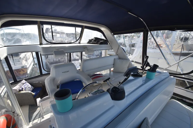 Slide: The Image of The cockpit of a 2000 Carver 356 Aft Cabin Motor Yacht with helm and seating area. - 3