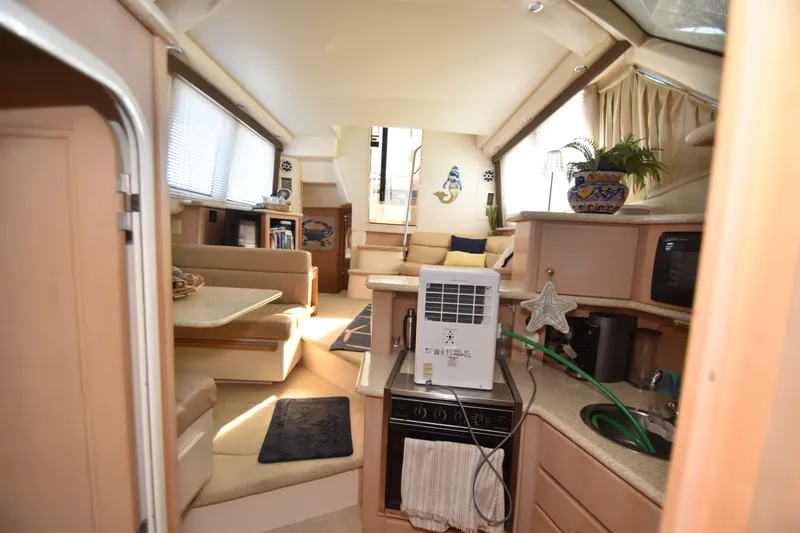 Slide: The Image of Interior of a 2000 Carver 356 Aft Cabin Motor Yacht with a cozy living area. - 12