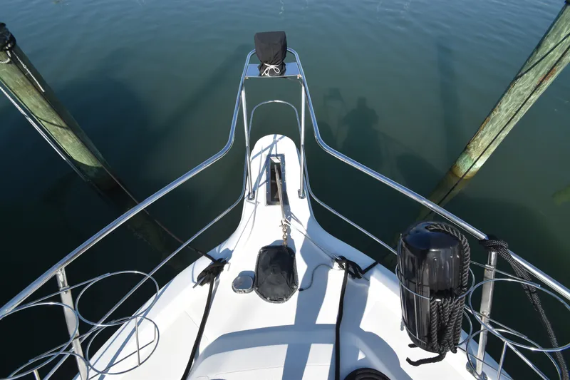 Slide: The Image of Bow view of a 2000 Carver 356 Aft Cabin Motor Yacht, featuring stainless steel railings and anchor windlass. - 18