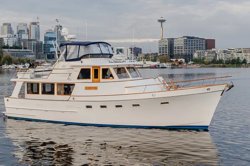 Slide: The Image of Ocean Alexander 50 Mark I yacht, 1992 model, cruising in urban waterfront setting. - 4