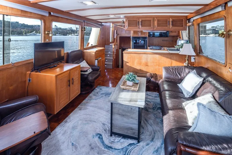 Slide: The Image of Luxurious interior of 1982 Ocean Alexander 50 Mark I yacht with leather seating and waterfront views. - 7