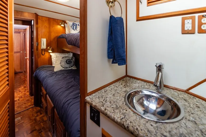 Slide: The Image of Interior of 1982 Ocean Alexander 50 Mark I yacht with bunk beds and sink. - 28