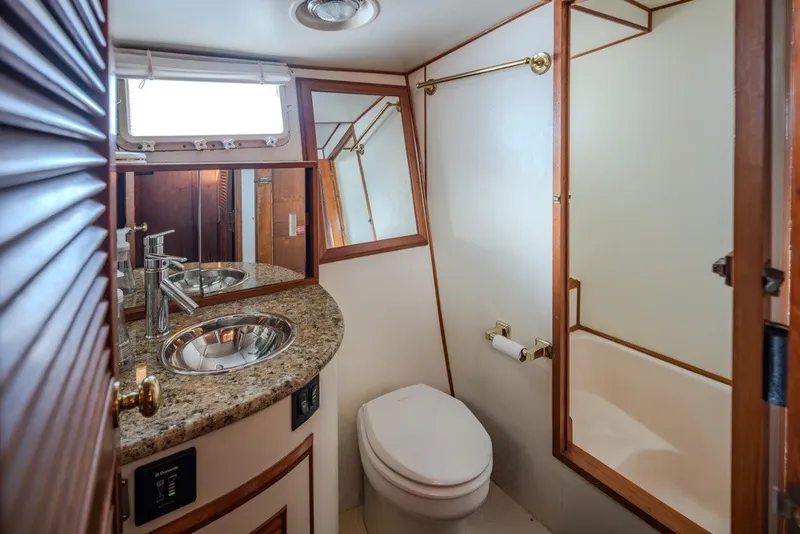 Slide: The Image of Luxurious bathroom in 1982 Ocean Alexander 50 Mark I yacht with granite countertop. - 20