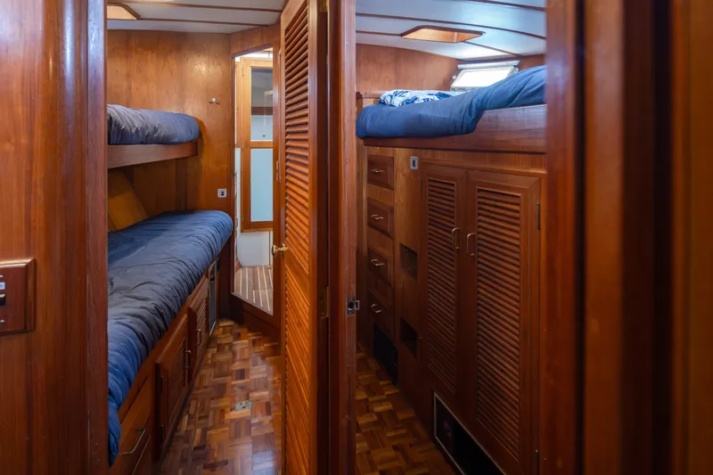 Slide: The Image of Interior of 1982 Ocean Alexander 50 Mark I yacht with wooden bunk beds and storage. - 25
