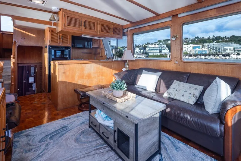 Slide: The Image of Interior of 1982 Ocean Alexander 50 Mark I yacht with cozy seating and large windows. - 10
