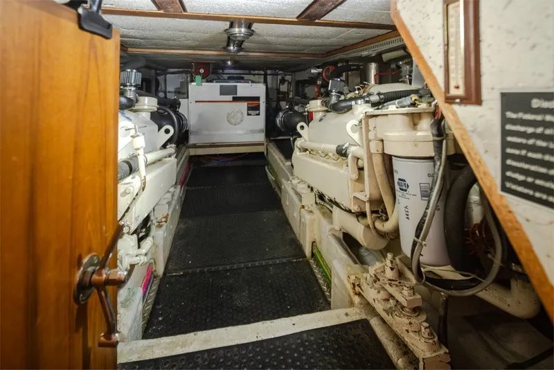 Slide: The Image of Engine room of 1982 Ocean Alexander 50 Mark I yacht, showcasing machinery and equipment. - 45