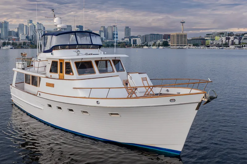 Slide: The Image of Ocean Alexander 50 Mark I yacht, 1992 model, docked with city skyline in the background. - 41