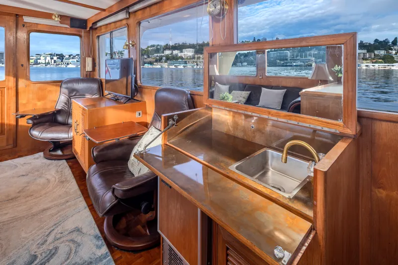 Slide: The Image of Luxurious interior of 1982 Ocean Alexander 50 Mark I yacht with leather seating and scenic views. - 11