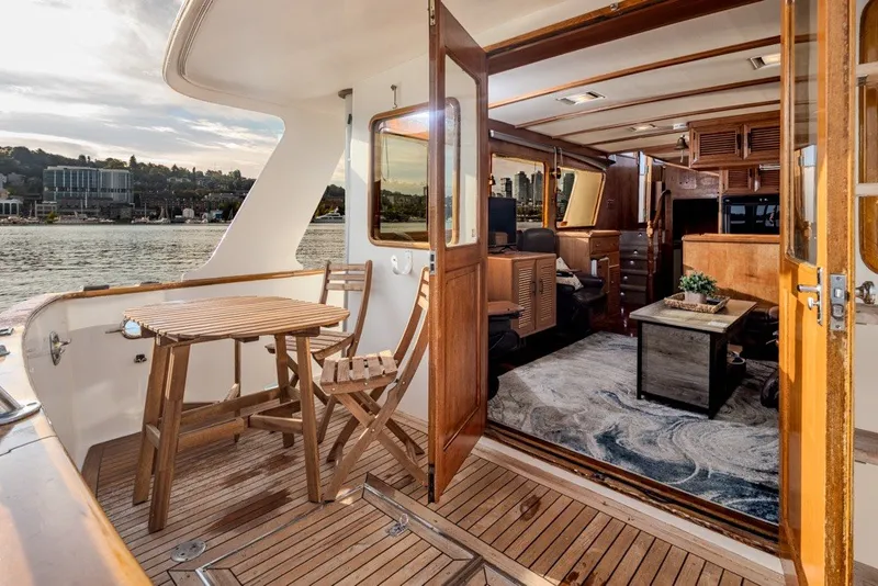 Slide: The Image of Ocean Alexander 50 Mark I yacht interior with wooden deck and seating, 1982 model. - 6