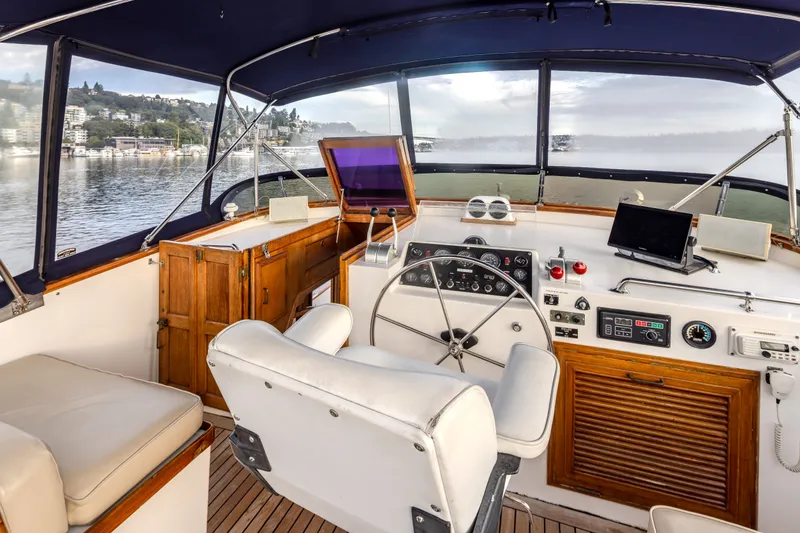 Slide: The Image of Interior view of 1982 Ocean Alexander 50 Mark I yacht helm with controls and seating. - 33