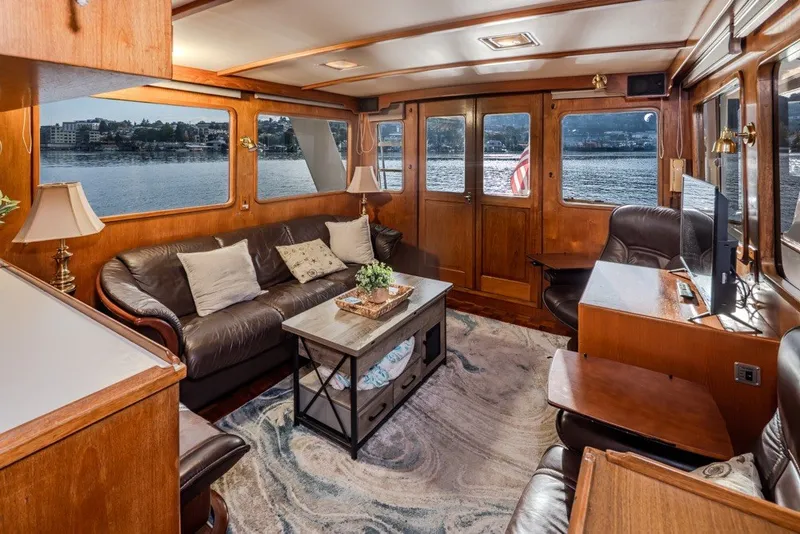Slide: The Image of Luxurious interior of 1982 Ocean Alexander 50 Mark I yacht with leather seating and waterfront views. - 8