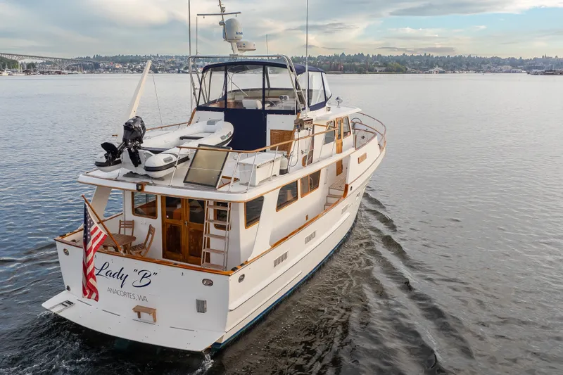 Slide: The Image of Ocean Alexander 50 Mark I yacht cruising on a calm lake, 1992 model. - 40