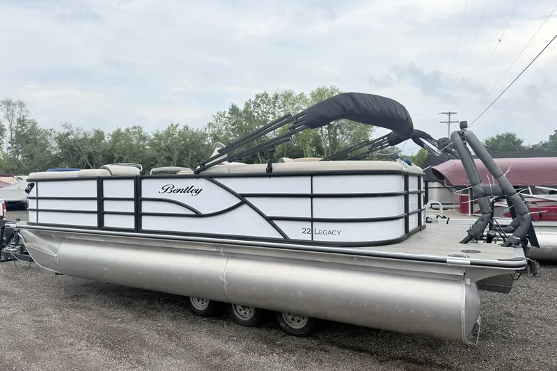 Slide: The Image of 2027 Bentley Pontoons Legacy 223 Navigator, sleek design, parked outdoors. - 2