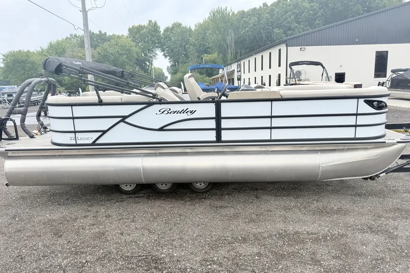 Slide: The Image of 2027 Bentley Pontoons Legacy 223 Navigator, sleek design, parked outdoors. - 4