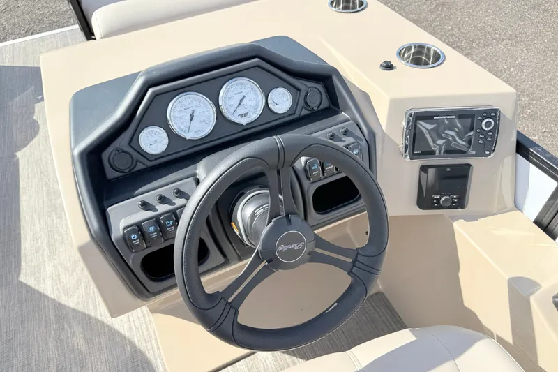 Slide: The Image of 2027 Bentley Pontoons Legacy 223 Navigator dashboard with steering wheel and control panel. - 12