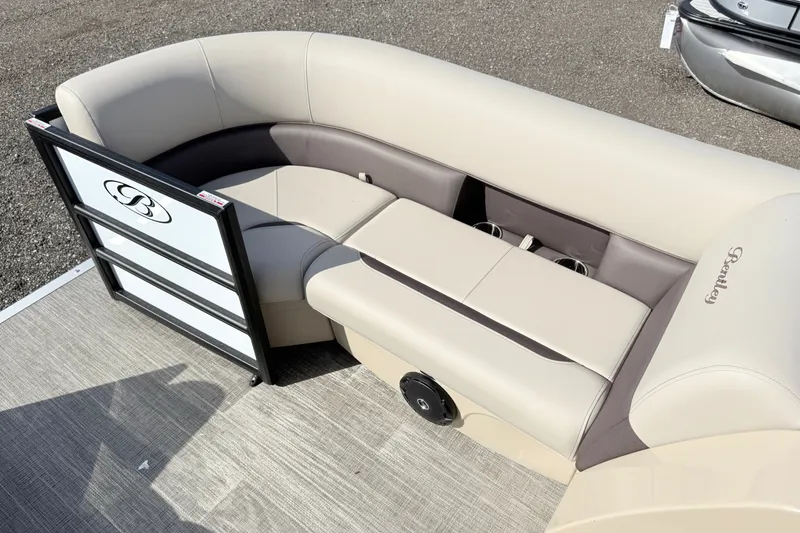 Slide: The Image of 2027 Bentley Pontoons Legacy 223 Navigator interior with beige seating and cup holders. - 8