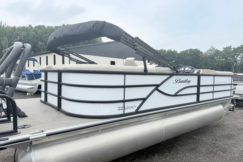 Slide: The Image of 2027 Bentley Pontoons Legacy 223 Navigator, sleek design, docked outdoors. - 3
