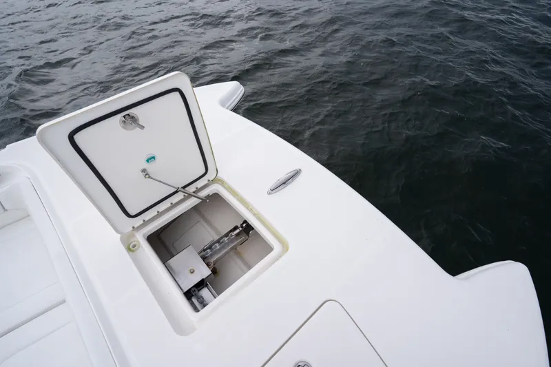 Slide: The Image of Open hatch on 2021 World Cat 400 CC-X boat, showing storage compartment. - 23