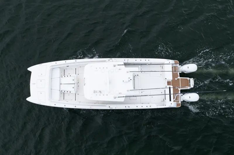 Slide: The Image of Aerial view of 2021 World Cat 400 CC-X boat cruising on water. - 7