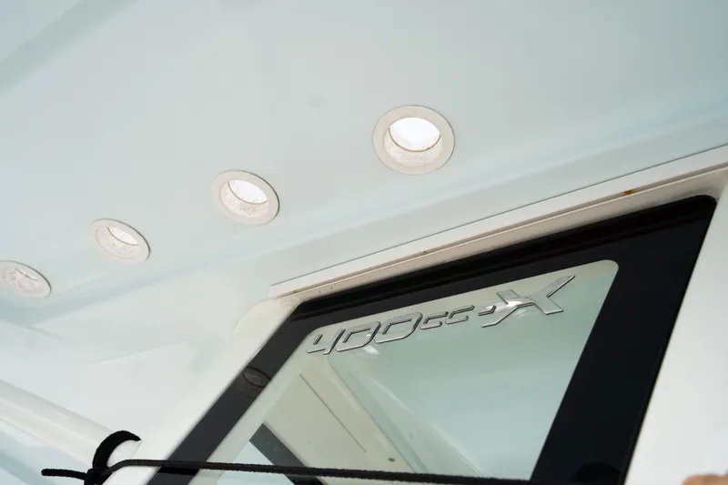 Slide: The Image of World Cat 400 CC-X 2021 boat interior detail with logo and lighting. - 26
