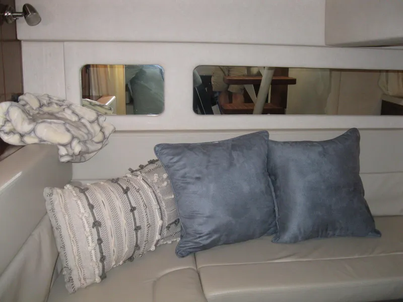 Slide: The Image of Interior of 2008 Sea Ray 330 Sundancer with cozy cushions and elegant decor. - 51