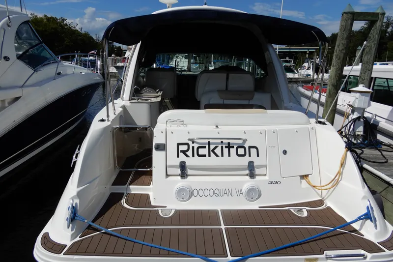 Slide: The Image of 2008 Sea Ray Sundancer 330 docked, rear view with name "Rickiton" visible. - 6