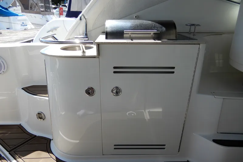 Slide: The Image of Outdoor kitchenette on a 2008 Sea Ray Sundancer 330 yacht with sink and grill. - 16
