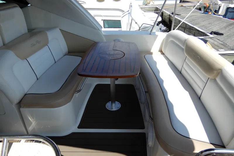 Slide: The Image of Luxurious seating area on a 2008 Sea Ray Sundancer 330 yacht with wooden table. - 13