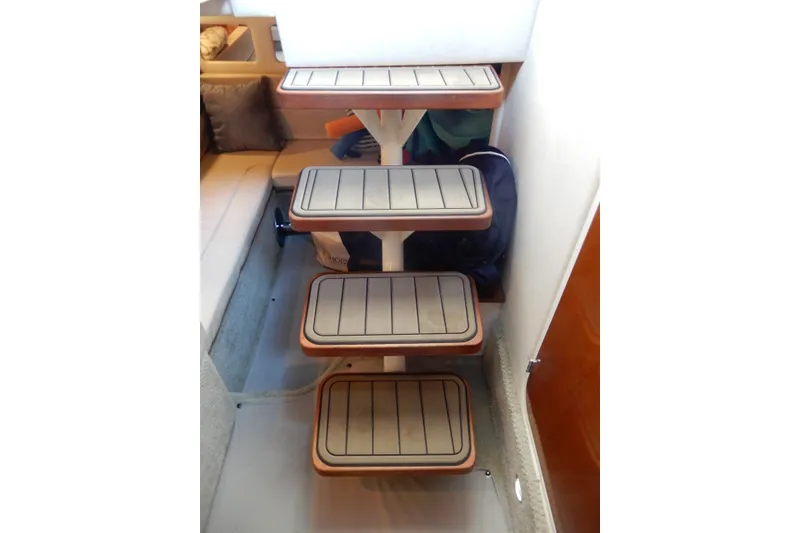 Slide: The Image of Interior stairs of a 2008 Sea Ray Sundancer 330 yacht, featuring wooden steps. - 39