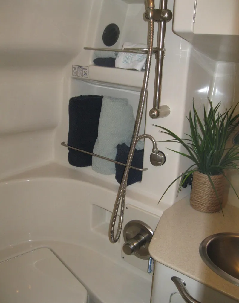 Slide: The Image of Bathroom interior of 2008 Sea Ray 330 Sundancer with shower and sink. - 56