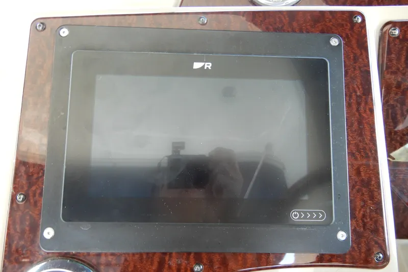 Slide: The Image of Dashboard screen of a 2008 Sea Ray Sundancer 330 boat, featuring a sleek design. - 32