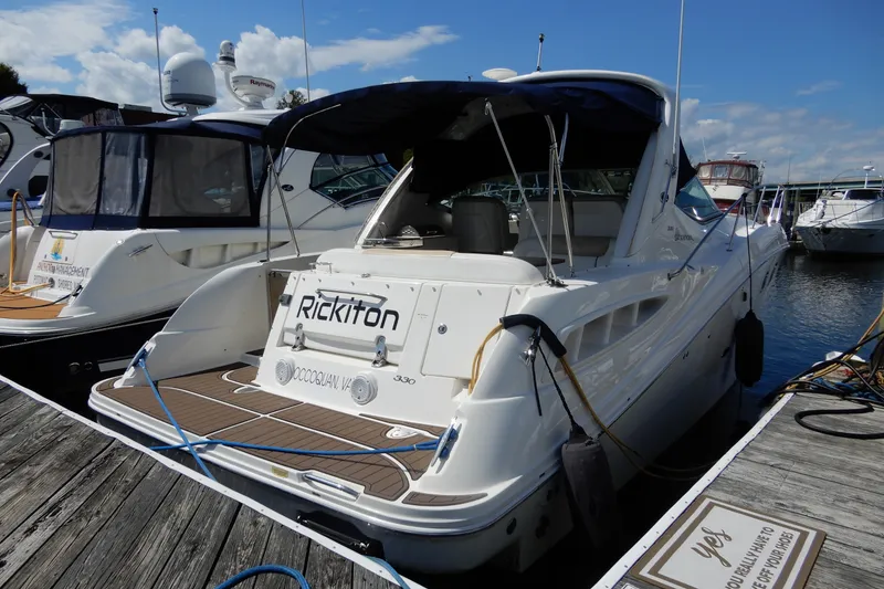 Slide: The Image of 2008 Sea Ray Sundancer 330 docked at marina under clear blue sky. - 7