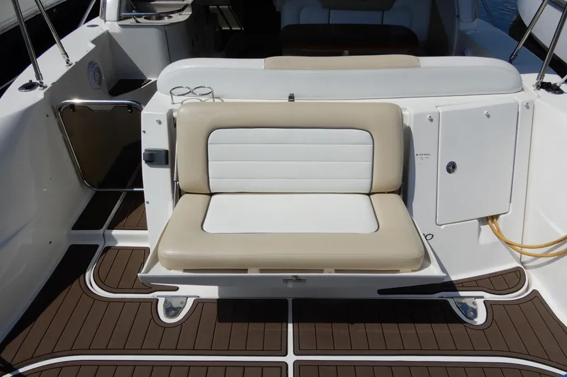 Slide: The Image of 2008 Sea Ray Sundancer 330 boat interior with beige and white seating. - 8