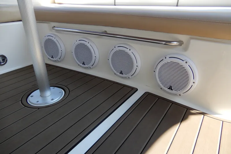 Slide: The Image of 2008 Sea Ray Sundancer 330 boat interior with speakers and teak flooring. - 15