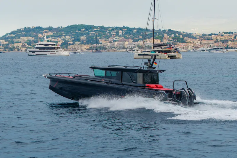 Slide: The Image of 2027 BRABUS 1000 luxury boat cruising on scenic coastal waters. - 4