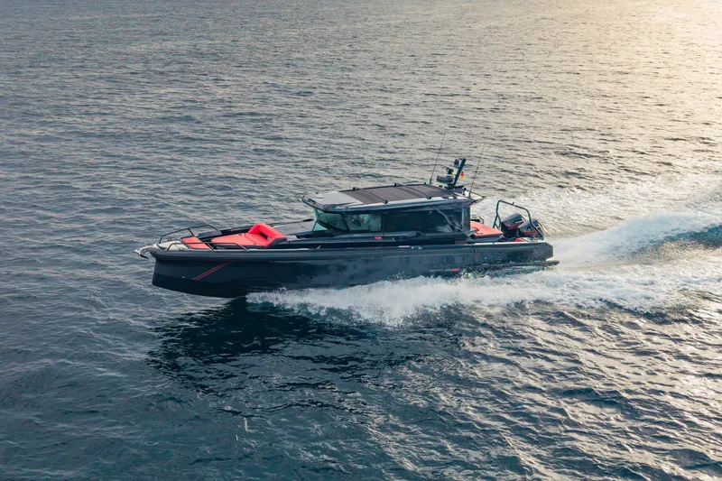Slide: The Image of BRABUS 1000 XC Cross Cabin 2027 cruising on the water at sunset. - 1