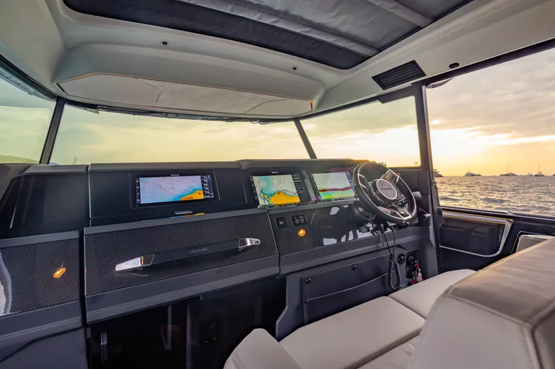 Slide: The Image of Interior of 2027 BRABUS 1000 yacht with advanced navigation displays at sunset. - 31