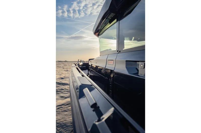 Slide: The Image of Side view of a 2027 BRABUS 1000 yacht on the water at sunset. - 21
