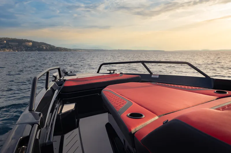 Slide: The Image of Luxurious BRABUS 1000 boat interior with red seating, cruising at sunset, 2027 model. - 18